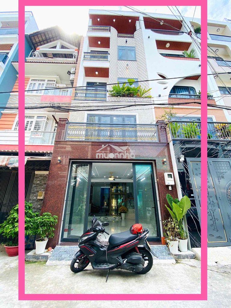 Nhà mới có thang máy, xe hơi để trong nhà. khu cao tầng